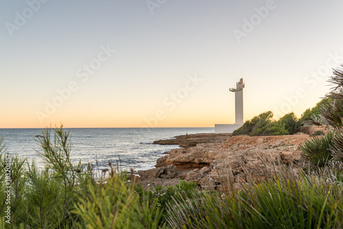 Atardecer desde el faro de Alcossebre en la Sierra de Irta, Castellón, España photo