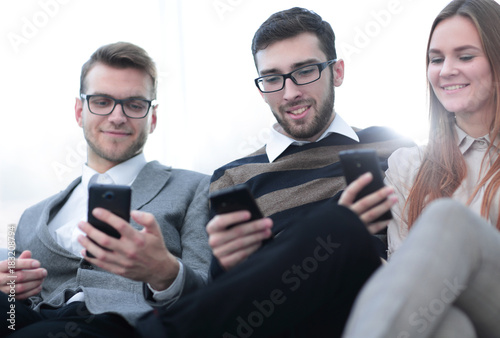 closeup. employees talking in the workplace © ASDF