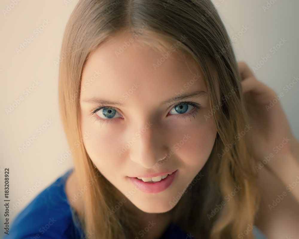 Cute Girl Looks at the Camera. Girl With Long Hair. Cute Girl Looks at the Camera. Girl With Long Hair.