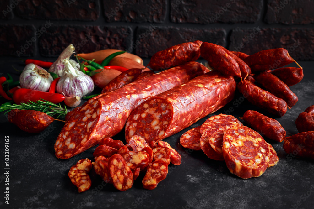 Fototapeta premium Variety of dry cured Spanish pork chorizo sausages made with paprika and garlic
