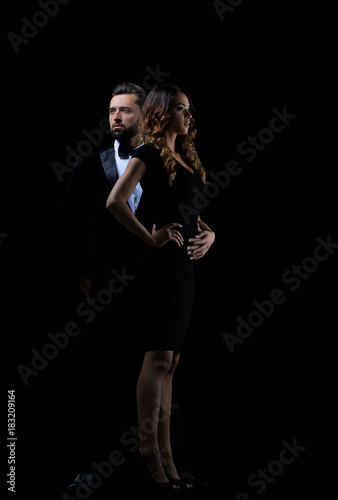 Hot girl in a black dress next to a businessman © ASDF