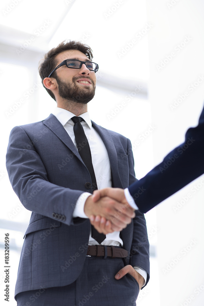 Bussines hand shaking will show succesful cooperation.