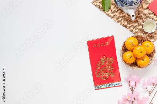 Flat lay image of accessories Chinese new year and Lunar new year festival concept background.Mix variety object for the season.Beautiful difference items on modern rustic wood at home office desk.