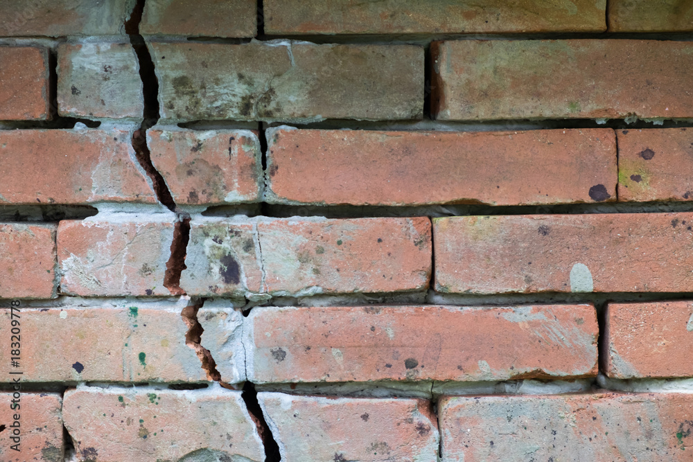 Brick wall with cracks Brick wall with cracks