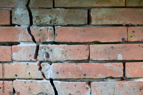 Brick wall with cracks