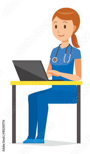 A woman nurse wearing a blue scrub is operating a laptop computer