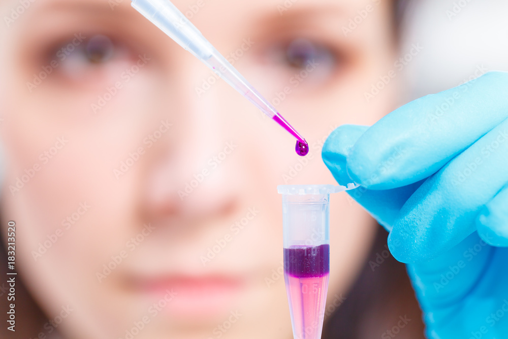 Female technician doing science experiment Female technician doing science experiment