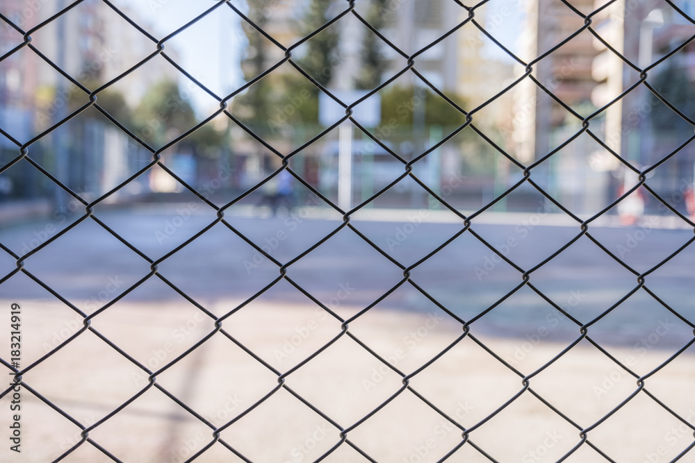 Protection Mesh Fence of Basketball Court Closeup Protection Mesh Fence of Basketball Court Closeup