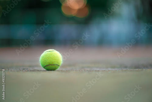 Tennis ball on green coating. Healthy lifestyle concept. Place for text. © Hairem