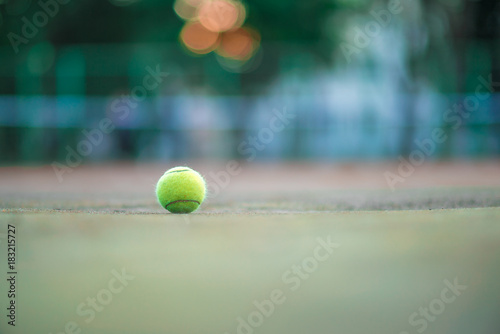 Tennis ball on green coating. Healthy lifestyle concept. Place for text. © Hairem