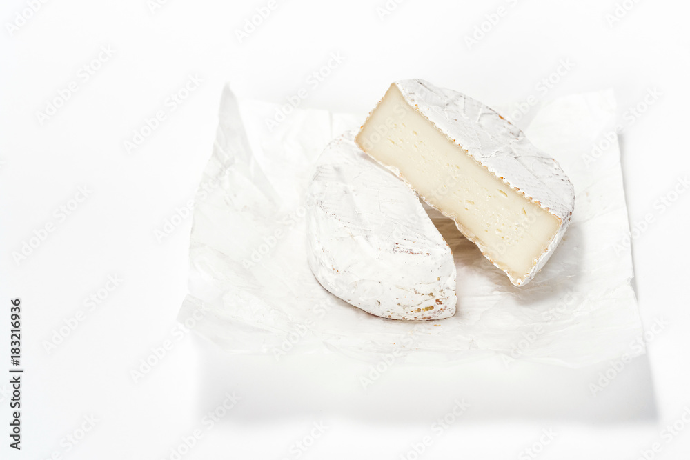 Cheese camembert on white paper. Menu design restaurant. Horizontal view. Cheese isolated.