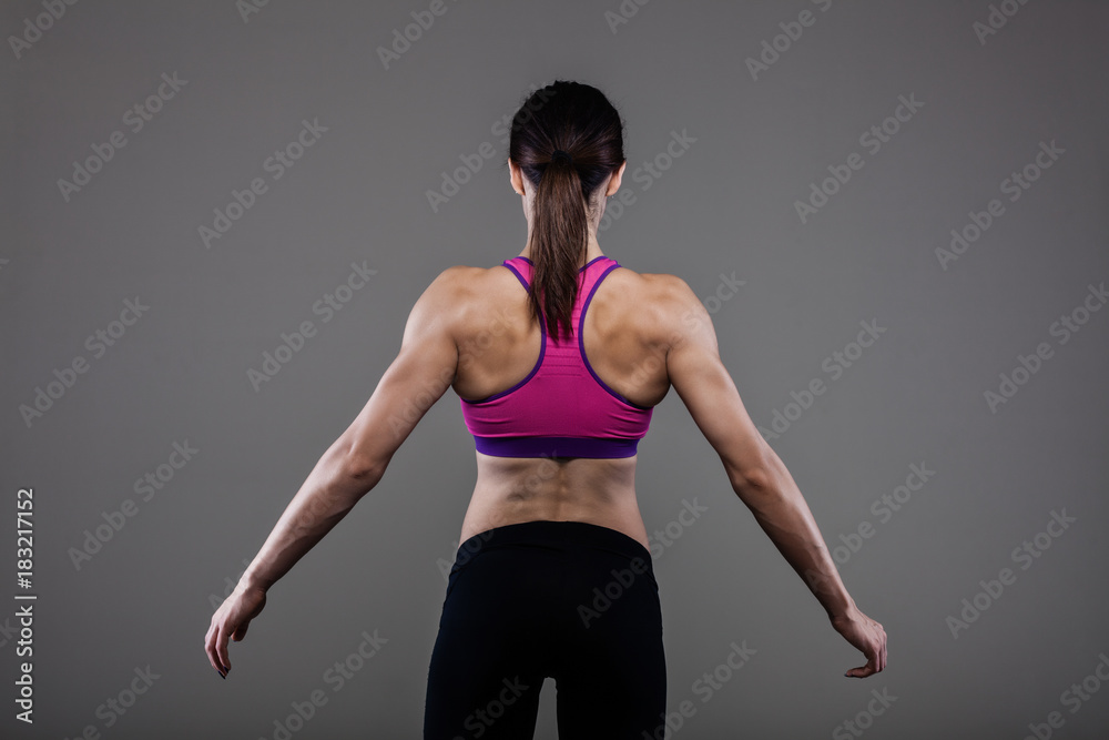 muscular back of a fitness girl