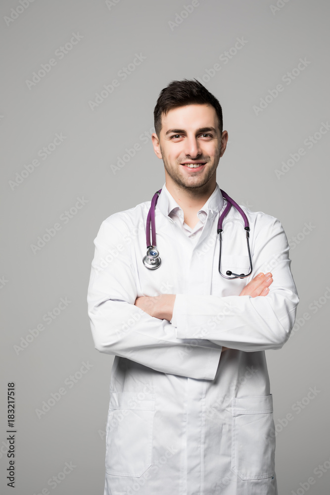 Young doctor man with stethoscope and crossed hands isolated on white background Young doctor man with stethoscope and crossed hands isolated on white background