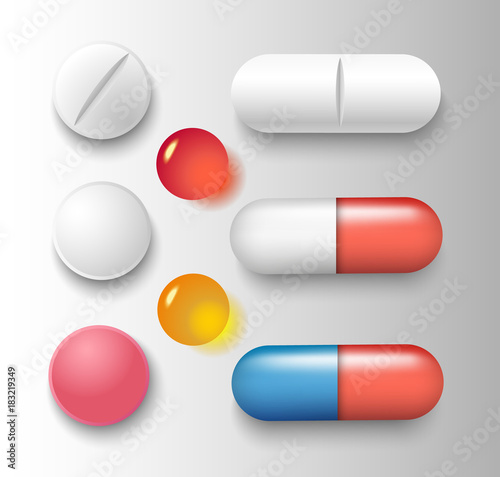 Vector group of various pills and capsules with shadows isolated on grey background