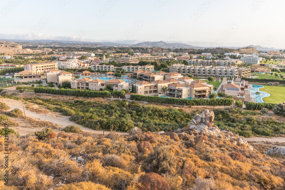 Stony landscape of Tsambika mountain and a view of Kolymbia in the early morning, a small resort on the Rhodes Island, Greece. 