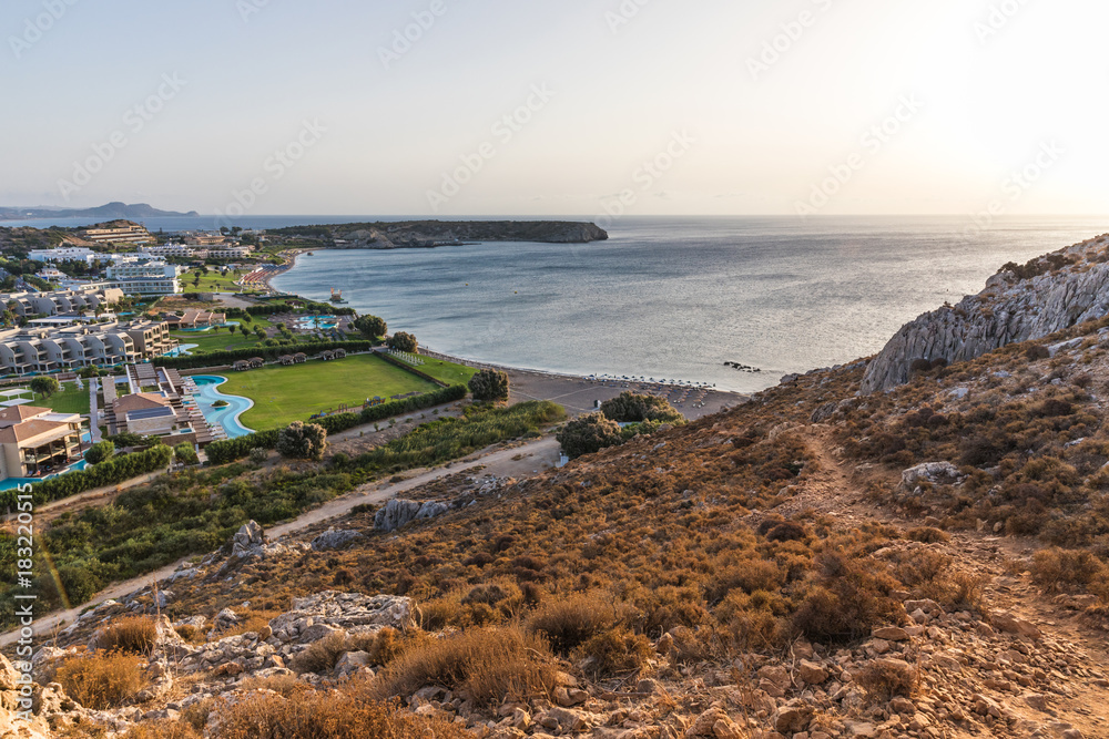 Stony landscape of Tsambika mountain and a view of Kolymbia in the early morning, a small resort on the Rhodes Island, Greece. 