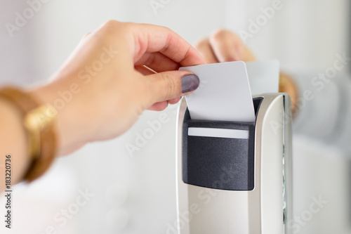 Close up of female hand opening keycard electronic lock