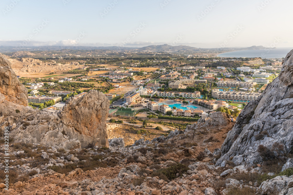 Stony landscape of Tsambika mountain and a view of Kolymbia in the early morning, a small resort on the Rhodes Island, Greece. 