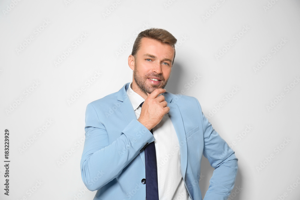 Attractive man in formal suit on white background Attractive man in formal suit on white background