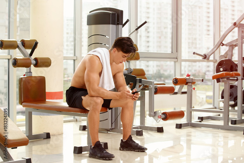 Muscular young man in gym