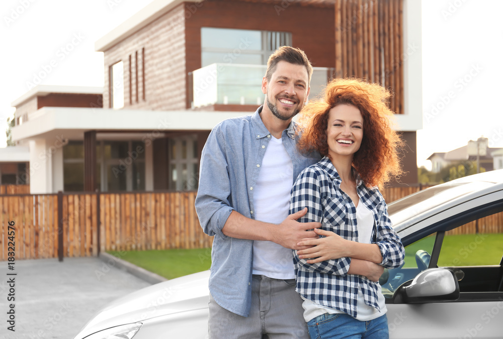 Fototapeta premium Happy young couple near car