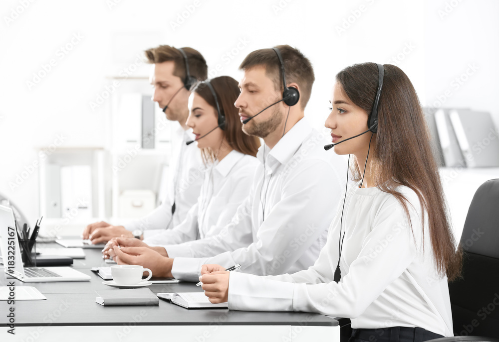 Consulting managers with headsets in office