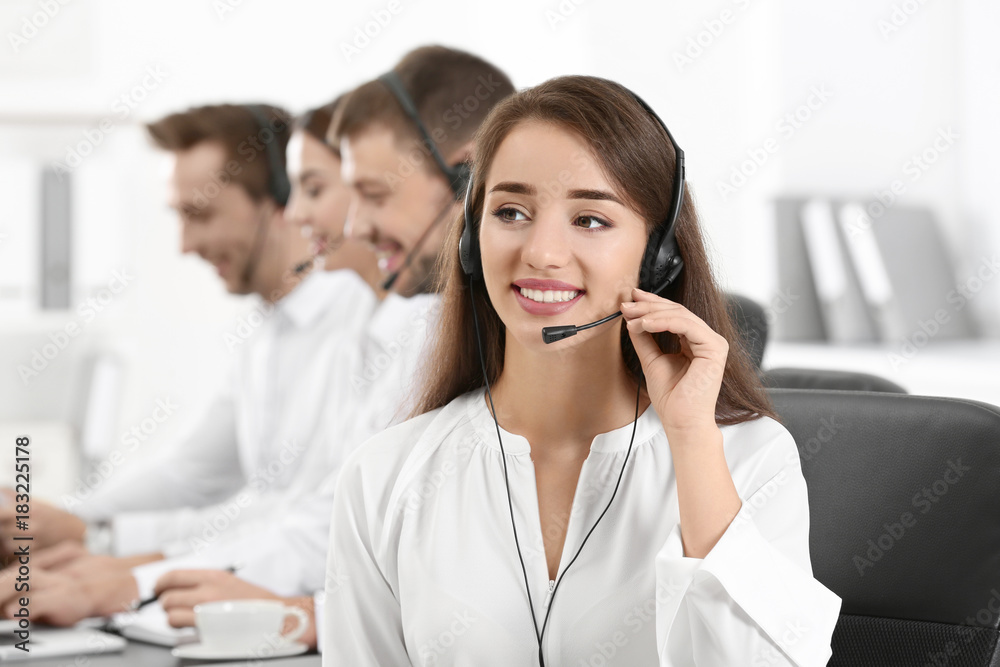 Female consulting manager with headset in office Female consulting manager with headset in office
