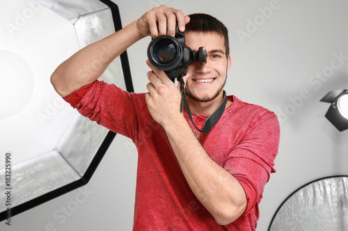 Young photographer working ...