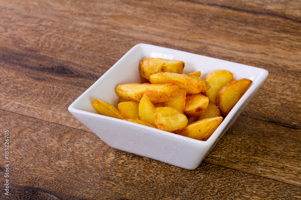 Rustic potato over wooden background Rustic potato over wooden background
