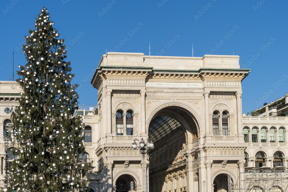 Christmas tree and Galleria Vittorio Emanuele in Duomo square, Milan, Italy.