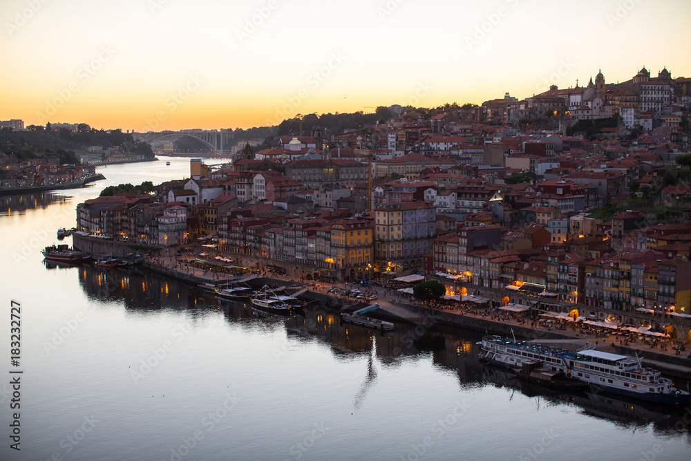 Douro river and Ribeira from Dom Luis I bridge at night, Porto, Portugal.