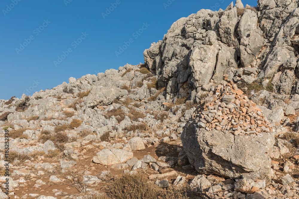 Stony landscape with trees of the Tsambika mountain on the Rhodes Island, Greece
