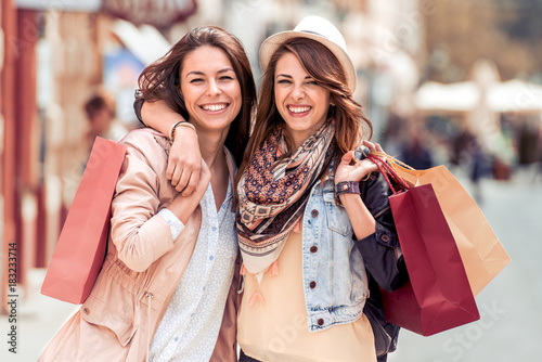 Young trendy women shopping in the city.