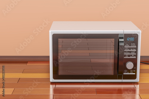 Modern Microwave in room on the wooden floor, 3D rendering