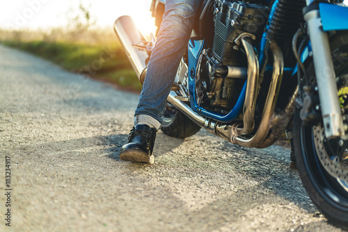 Photos Man on sport motorcycle outdoor on the road