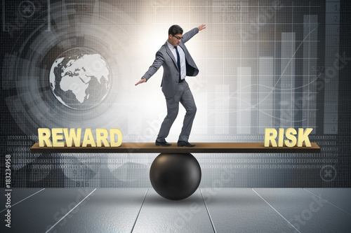 Obraz na plátně Businessman balancing between reward and risk business concept