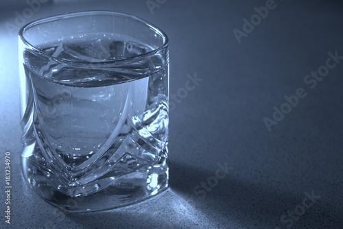 glass of water on a blue background