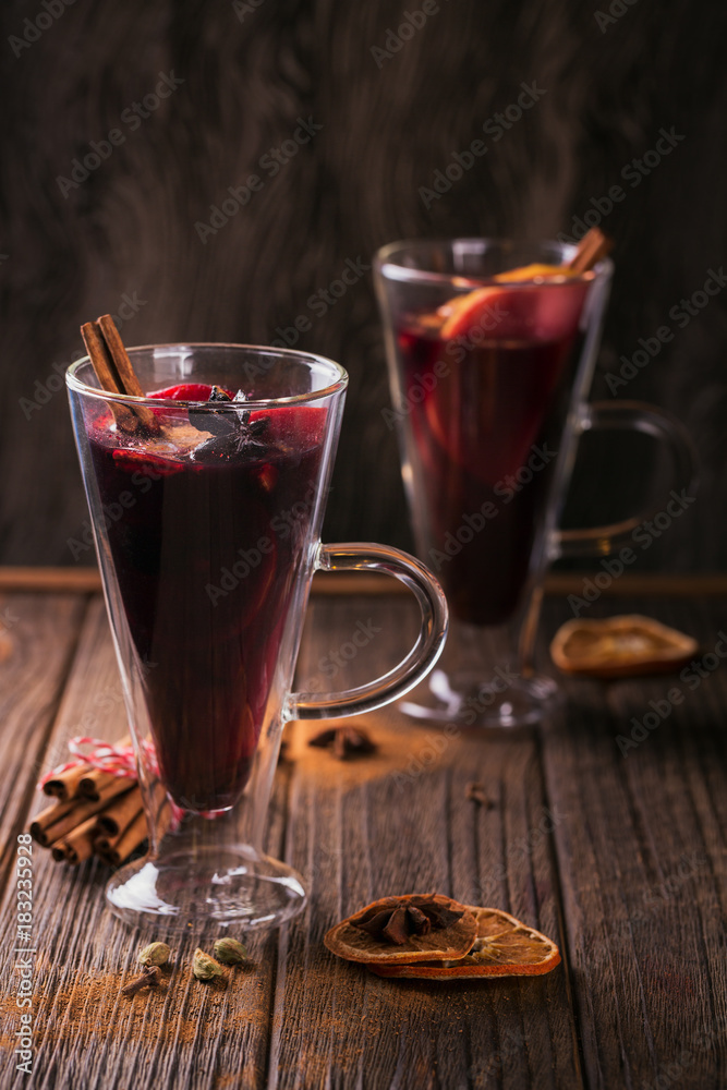 Mulled wine with fruits, cinnamon sticks, anise and decorations Mulled wine with fruits, cinnamon sticks, anise and decorations