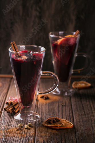 Mulled wine with fruits, cinnamon sticks, anise and decorations