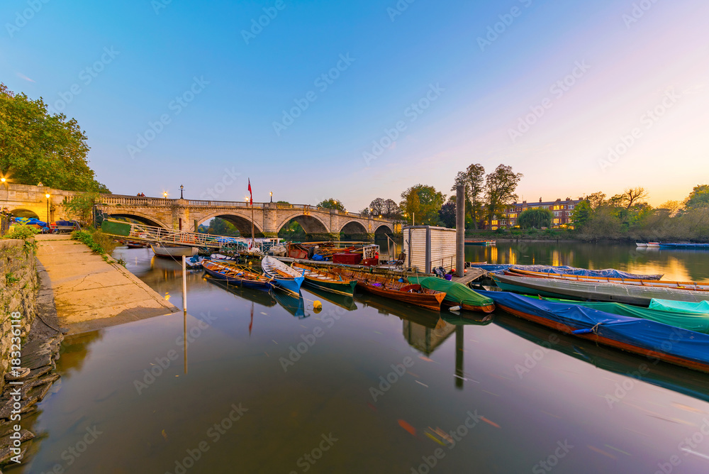 Boats and richmond bridge at dusk