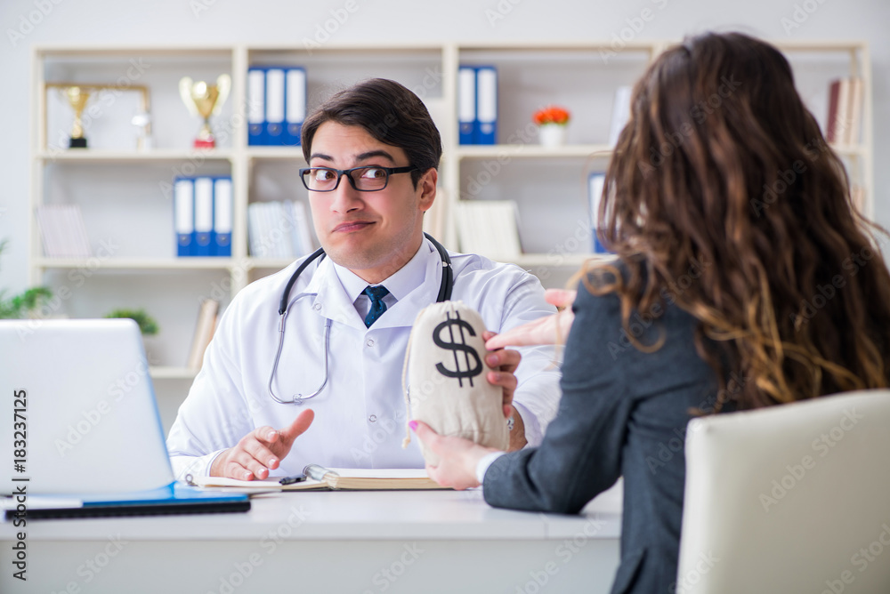 Young doctor in medical insurance fraud concept Young doctor in medical insurance fraud concept
