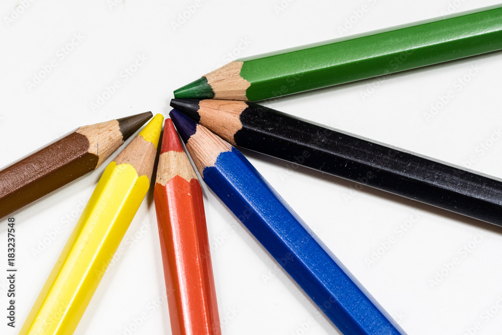 Cute baby pencil crayons on a white table. Isolated background. Cute baby pencil crayons on a white table. Isolated background.