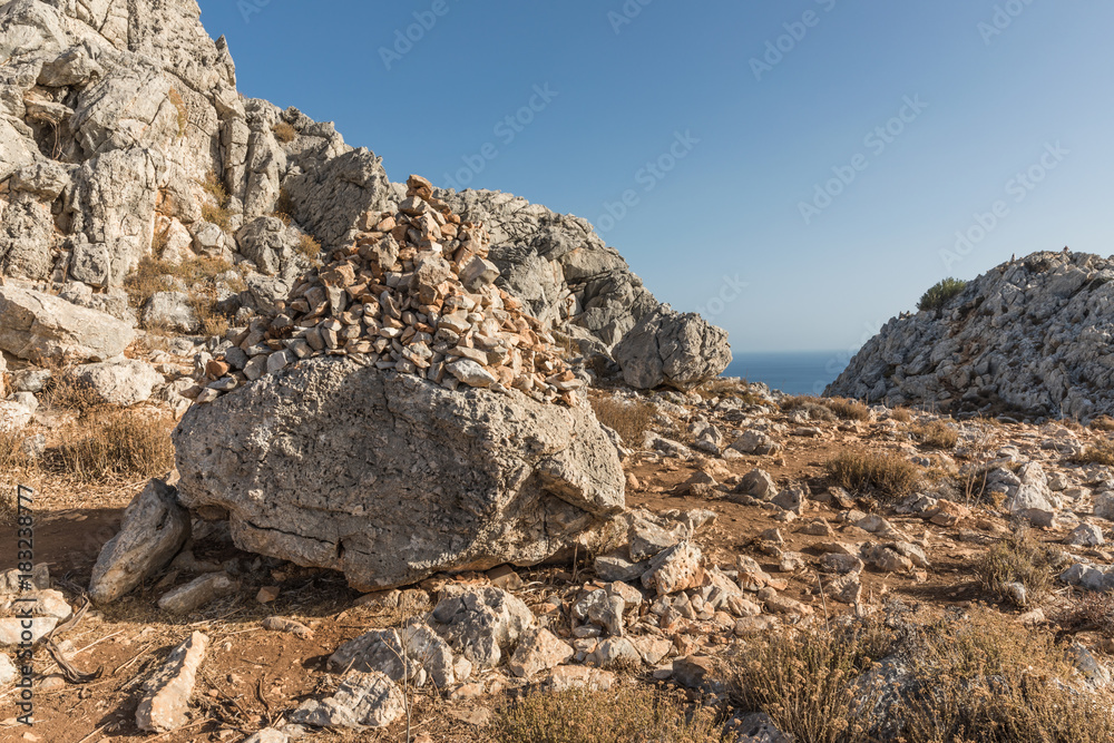 Stony landscape with trees of the Tsambika mountain on the Rhodes Island, Greece