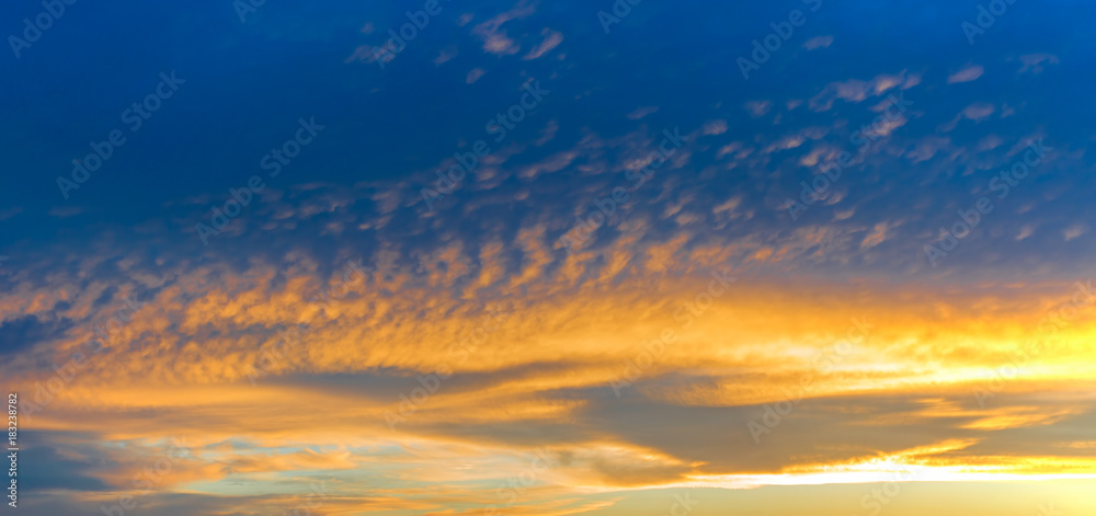 Golden sunset with deep blue sky at dusk