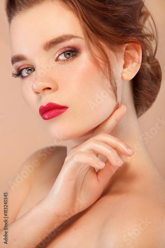 Closeup portrait of beautiful young woman with clean and fresh skin. Nude makeup. Facial treatment . Concept for cosmetology, beauty and spa .