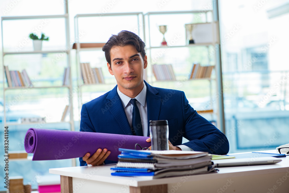 Man getting ready for sports break in the office Man getting ready for sports break in the office