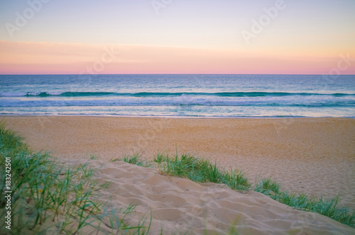Fototapeta Naklejka Na Ścianę i Meble -  Beautiful Pink Sunset at the beach