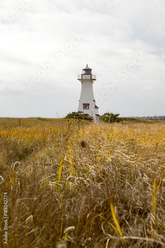 Lighthouse in tall grasses, Prince Edward Island, Canada