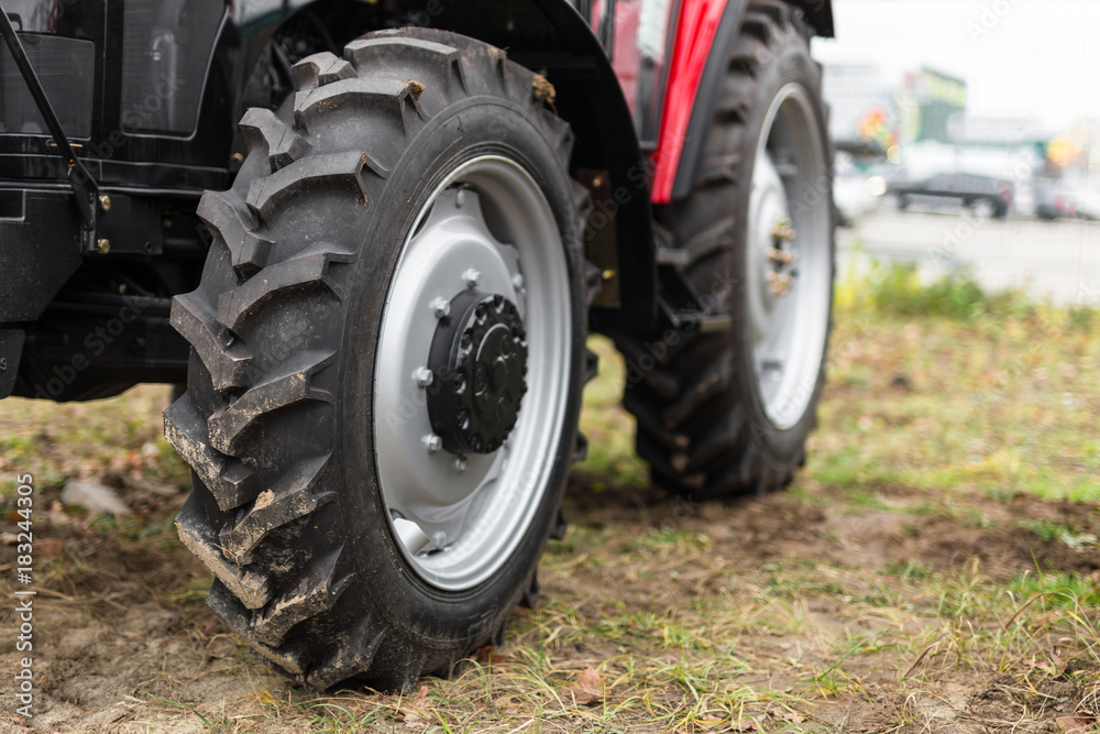 Equipment for agriculture, machines presented to an agricultural exhibition. Tractors outdoors Equipment for agriculture, machines presented to an agricultural exhibition. Tractors outdoors