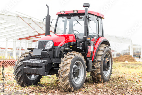 Equipment for agriculture  machines  presented to an agricultural exhibition.  Tractors outdoors